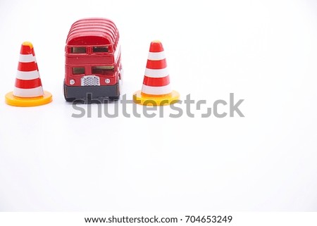 Safety cones with bus on white background