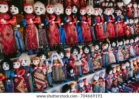 Dolls in Armenian national costumes. Flea market Vernissage Yerevan, Armenia Royalty-Free Stock Photo #704669191