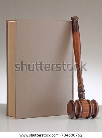 Wooden gavel and books.