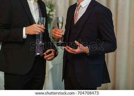 A man is holding a glass
