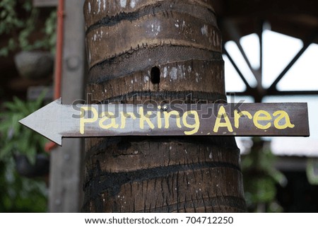 wooden parking area sign