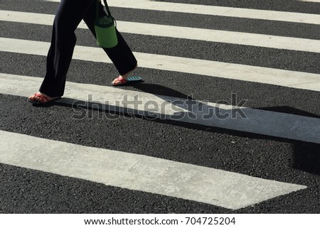 people walk through the zebra crossing
