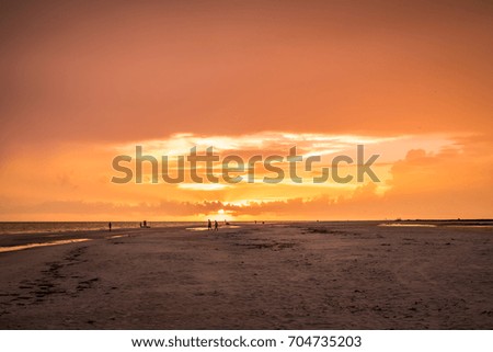 Sunset While Walking Down the Beach 