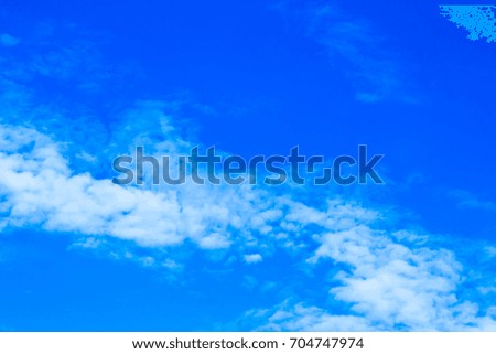 Bright blue sky with white clouds