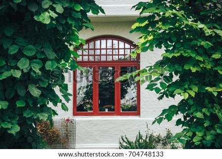 Detail of colorful window on old traditional house