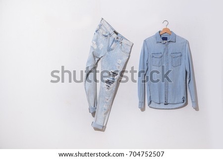 Leg torn jeans with shirt jeans isolated 