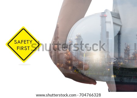Worker holding an helmet in a Oil refinery industry  , power , fuel ,gas isolated on white background and Warning label Safety. Safety in factory Concept. double exposure picture
