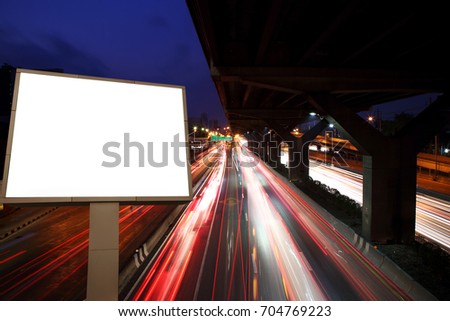 blank white billboard on light trails, street and urban in the night - can advertisement for display or montage product or business.