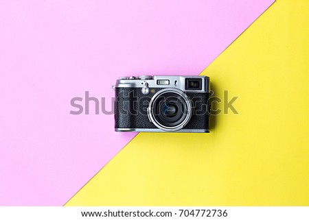Flat lay vintage camera  on pastel background