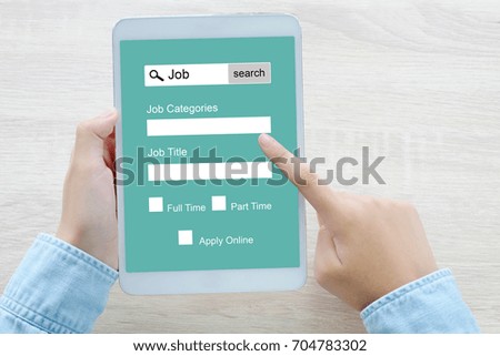 Hand using tablet searching job online on screen device, business and technology concept 
