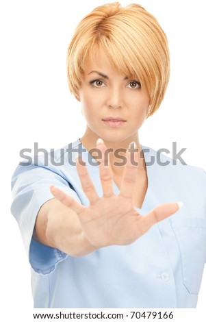 bright picture of attractive female doctor showing stop gesture