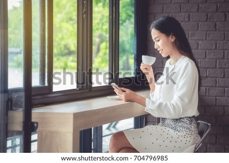 Office women are drinking coffee during a break during the day to refresh.