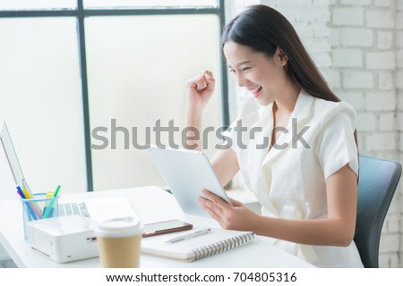 Sale of online asian woman special she is satisfied with sales success Royalty-Free Stock Photo #704805316