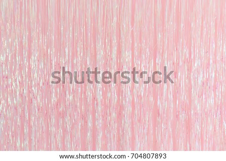 pink foil fringe curtain or plastic rope party decoration backdrop. Royalty-Free Stock Photo #704807893