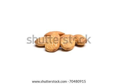 This is a shot of a pile of almonds shot with a shallow depth of field on an isolated white background.