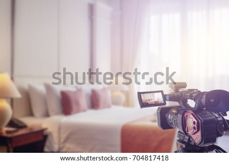 Video camera taking video streaming set in hotel room luxury