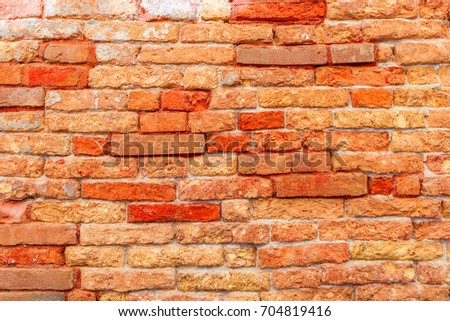 Texture of a brick wall made from an old red bricks. Picture taken in Venice. Italy.