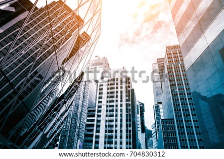 Modern office building detail, glass surface Royalty-Free Stock Photo #704830312