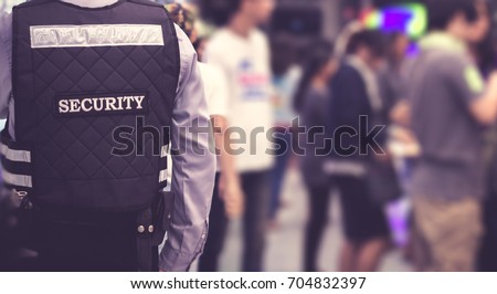 Security man standing indoor / soft focus picture / Vintage concept
