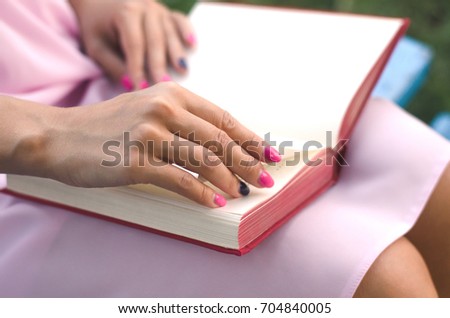 Blurred student girl reading book.