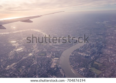  Aerial view of Central London through airplane window vintage colour