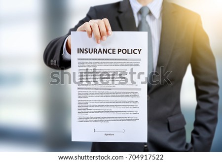 businessman show insurance policy
