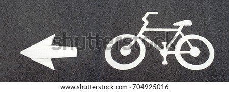 Bicycle road sign and arrow, bicycle symbol lane.