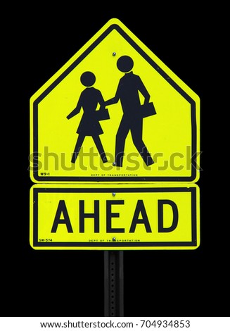 Texture: Die Cut of School Ahead Sign with Black Symbol on Yellow Background. Traffic Sign.
