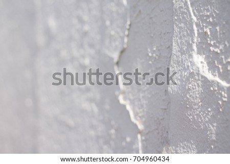 blurred white rough wall surface