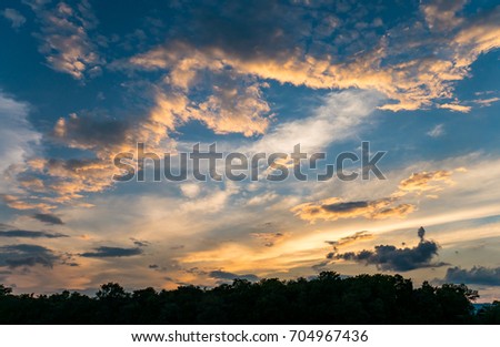 Sunlit clouds at dusk