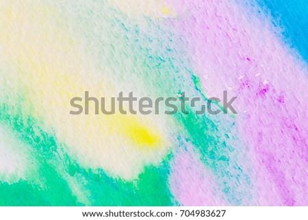 Colored watercolor paints on paper background
