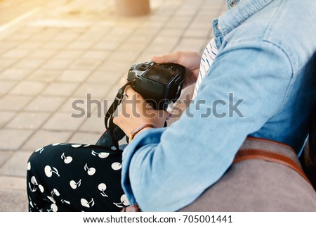 Asian women using camera on the train station ,alone and wait to travel, Hipster tone