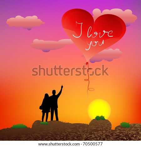 Couple standing on the rocks and guy showing heart-shape balloon at sunset