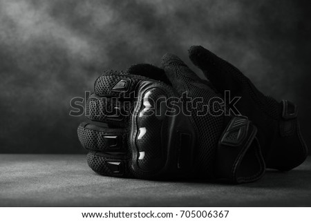 Motorcycle gloves on wooden background,with copy space -vintage effect.