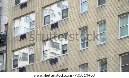 Standard urban city brick apartment or dorm style building exterior establishing facade photo