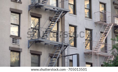 Generic apartment building fire escape exterior establishing photo