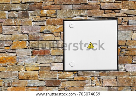 Stone wall cladding with a box on the energy of the house.