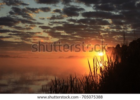 Dawn in the fog over the Sanahta River in August