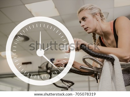 Digital composite of Clock icon against woman exercising photo