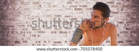 Digital composite of Tired man training against purple brick wall