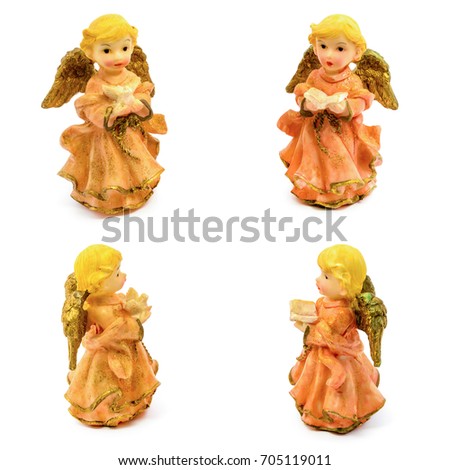 Set of statuettes of porcelain angels with book and pigeon isolated on white background