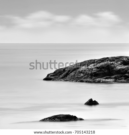 Minimalist Seascape, Long exposure photo of rock and beach 