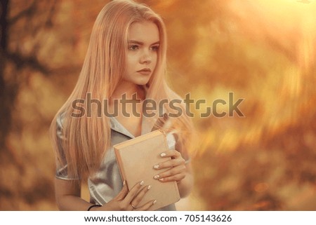 Young girl in autumn portrait, blond adult
