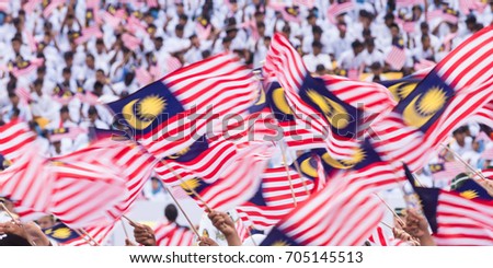 Creative Motion Blur - Waving Malaysia Flags Royalty-Free Stock Photo #705145513