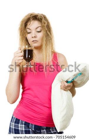 Grumpy tired woman holding black coffee about to drink. Hard morning, getting energy.