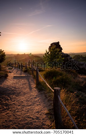 Path towards the sunset in the Harz at the Teufelsmauer