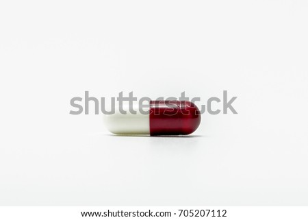 Red-white capsule pills isolated on white background. Capsule symbol for pharmacy shop. Antibiotic drug resistance concept. Antibiotics drug use with reasonable. Pharmaceutical industry. Drugstore.