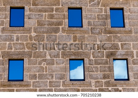 Sky reflected on the windows of a nice facade