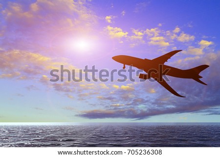 Silhouette of airplane taking off flight with blue sky background
