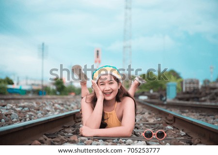 Hipster asian fat girl pose for take a photo,Fashion portrait pretty woman at railway,lifestyle of modern teenage thai girl,Colorful cloths,thailand people